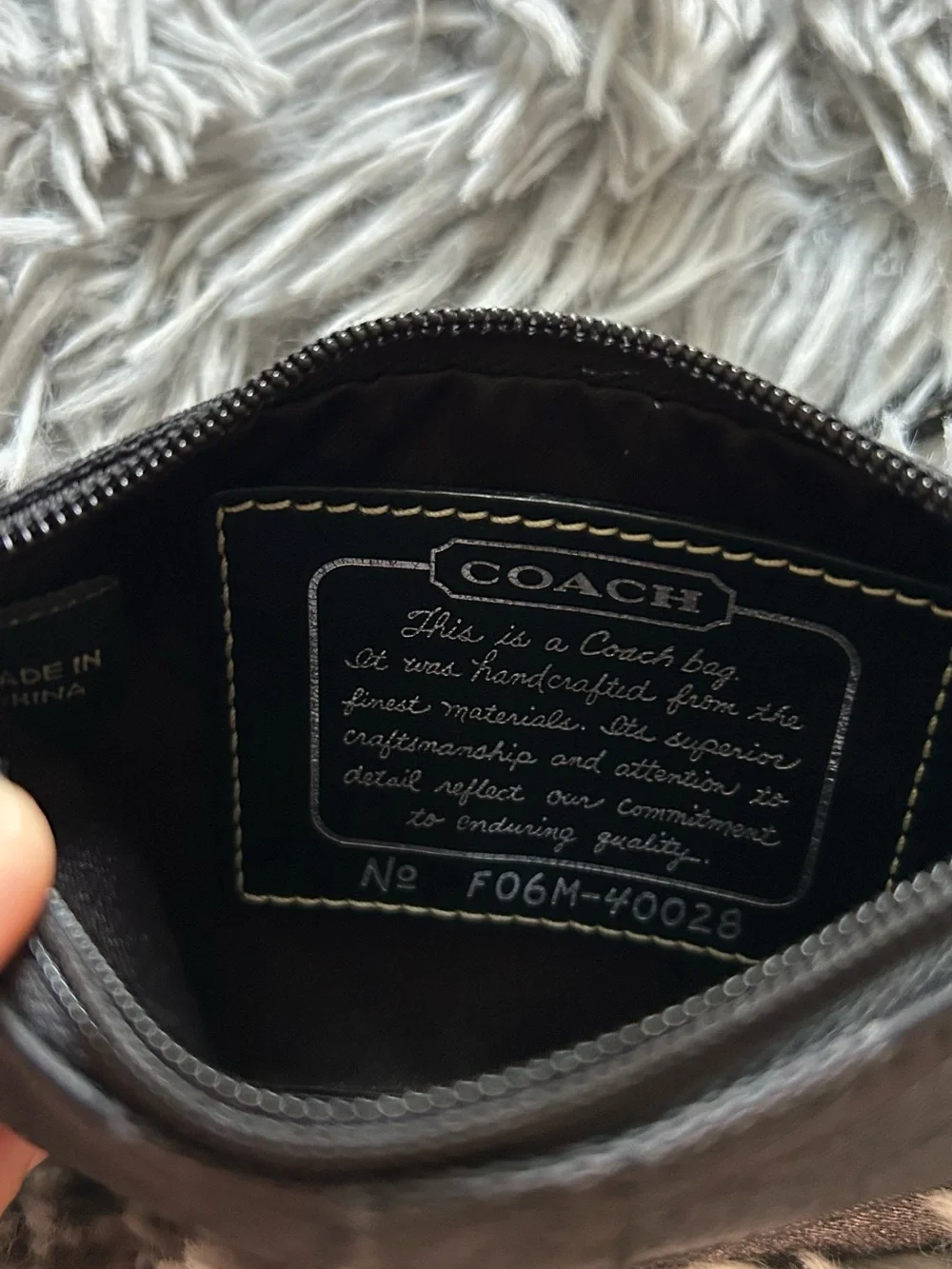 Coach wristlet featuring